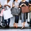 female-friends-out-shopping-together-min